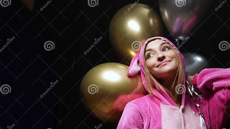 Girl In Pink Kigurumi Pajamas With Balloons Pajama Party Stock Image