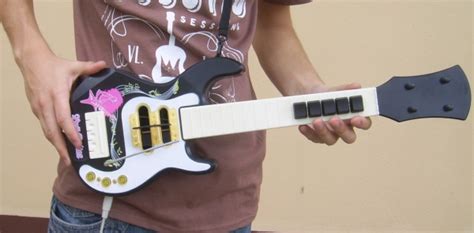 Guitar Hero Controller Built From Toy Guitar And Keyboard Hackaday