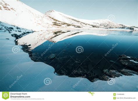 Frozen Mountain Lake With Blue Ice Stock Image Image Of Range Meadow