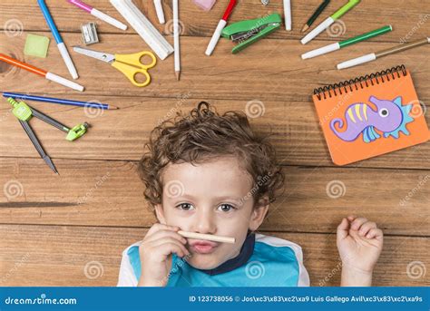 Child Surrounded By School Supplies Stock Photo Image Of Preschooler