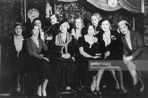 The club has been described by writers, and artist and have been immortaliz. A group of women and four transvestites at the bar of the ...