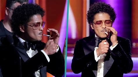 Watch Access Hollywood Highlight Bruno Mars Lit A Cigarette Onstage At
