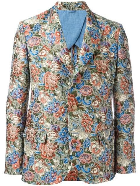 One button front closure peak lapel pattern jacket with suit bag great for all occasions. Ermanno Scervino floral pattern blazer