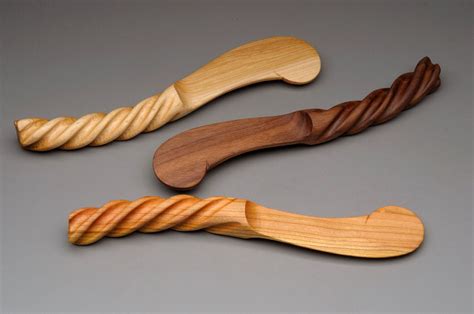 Hand Carved Curved Hardwood Spreader With Twisted Handle Carving