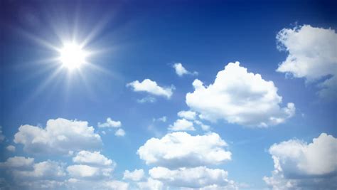 White Clouds Flying On Blue Sky With Sun Rays Time Lapse Motion