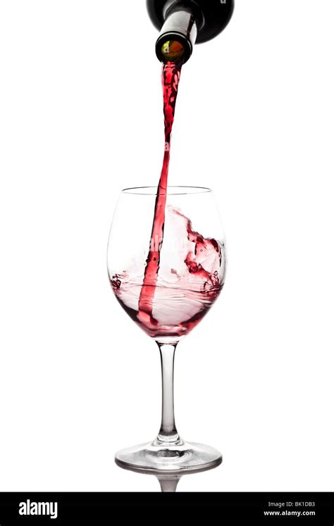 Red Wine Pouring Into A Wine Glass Stock Photo Alamy