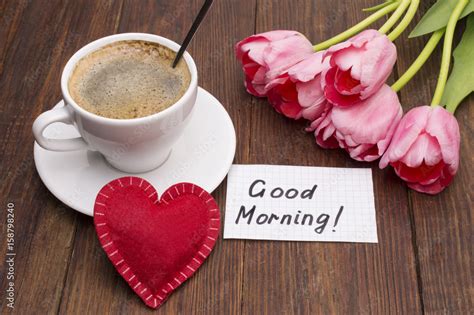 Foto Stock Cup Of Coffee Tulips Red Heart And Good Morning Massage