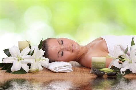 Woman Lying Down Relaxing On A Massage Bed At Spa Stock Image Image
