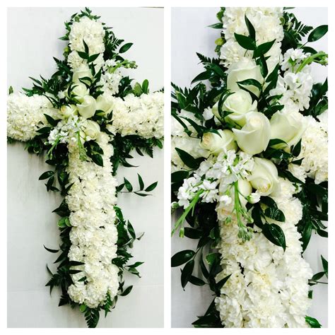 Classic all white sympathy cross for family service so beautiful