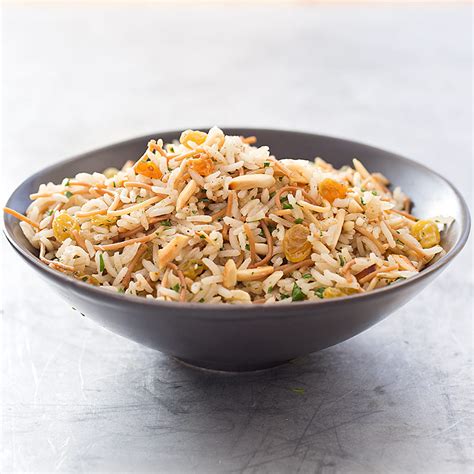 In this recipe, the grains are cooked with star anise, cinnamon, cardamom, and cloves—and topped with a tasty mix of toasted cashews and raisins. SFS_almond_golden_raisin_rice_and_pasta_pilaf-36.jpg