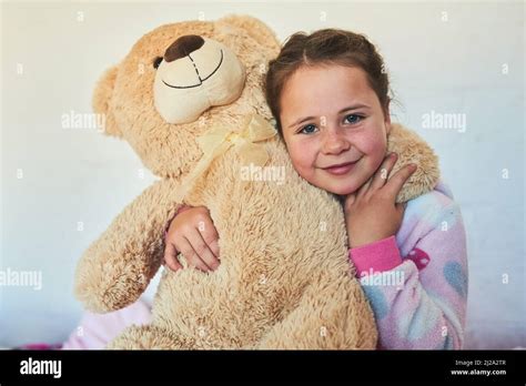 Meet My Cute And Cuddly Friend Portrait Of A Cute Little Girl Hugging