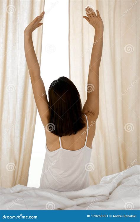 Woman Stretching Hands In Bed After Wake Up Sun Flare Brunette Entering A Day Happy And