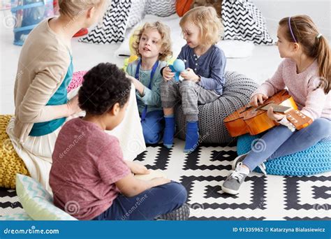 Sitting On A Carpet Stock Photo Image Of Class Group 91335962