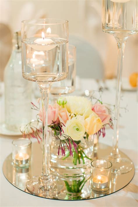 Floating Candle Centerpiece On A Round Mirror Base With Fresh Flowers