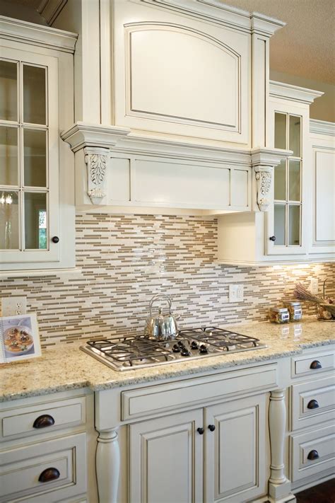 White Counters With Granite An Tile Backsplash Kitchen Cabinets