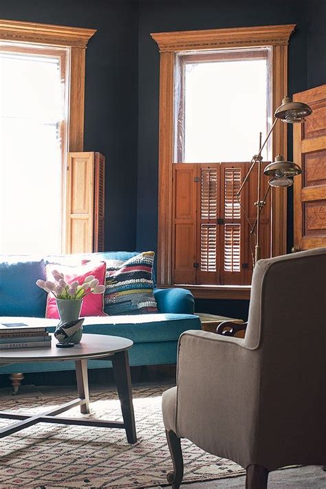 Like other decor elements, wood tones interact with surrounding colors to form an overall impression in the room. Black Walls, Teal Sofa, Moroccan Rug | Making it Lovely ...