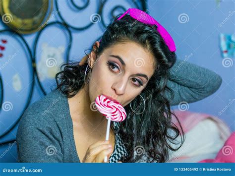 Beautiful Girl Is Licking A Pink Lollipop Stock Photo Image Of Light