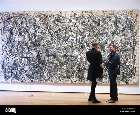 Visitors Admiring A Jackson Pollock Drip Painting Museum Of Modern Art