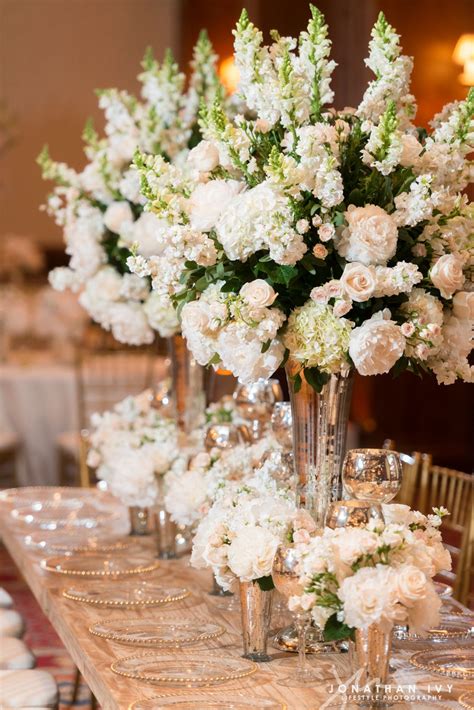 The history of flower arrangement dates back to ancient egyptian times. Large floral arrangements of white stock, peonies, and ...