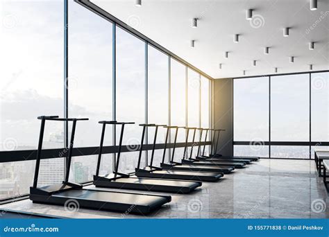 Empty Modern Gym With Black Treadmiils At City View Background At
