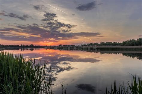 Twilight Above The Pond Or Lake With Cloudy Sky At Summer With Water