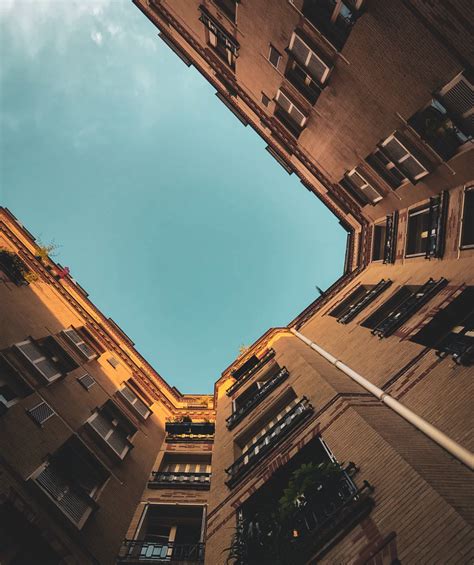 Worms Eye View Of Brown Concrete Building Photo Free Building Image