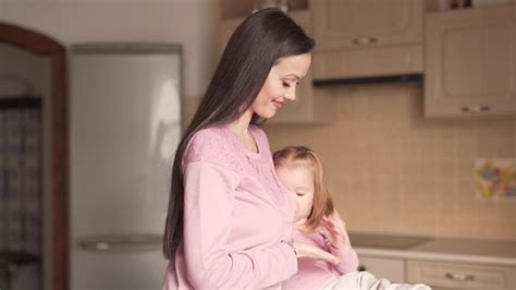 Mother Breastfeeding Her Daughter . Stock Footage Video (100% Royalty 