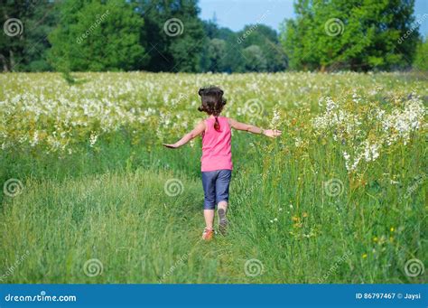 Child On Green Spring Meadow Kid Running And Having Fun Stock Image