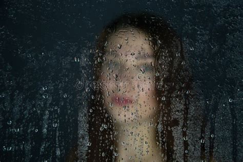 Photo Of Young Girl Behind Glass With Water Drops Stock Image Image