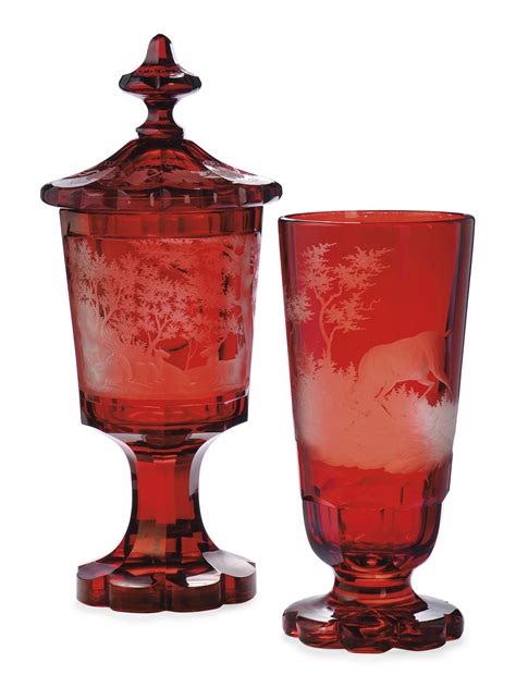 A Bohemian Ruby Stained Glass Jar And Cover And A Vase Third Quarter Of The 19th Century