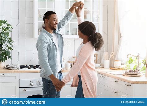 loving black spouses dancing in white kitchen interior having time at home stock image image