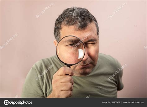 Man Looking Through Magnifying Glass Stock Photo By ©ahmetnaim 183572426
