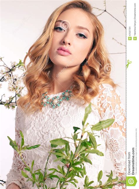 Beautiful Young Woman With Blond Curly Hair Wears Elegant Clothes And Bijou Stock Image
