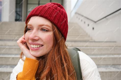 Premium Photo Close Up Portrait Of Beautiful Redhead Girl In Red Hat Urban Woman With Freckles