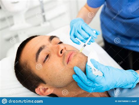 Man Receiving Face Injections At Beauty Clinic Stock Photo Image Of