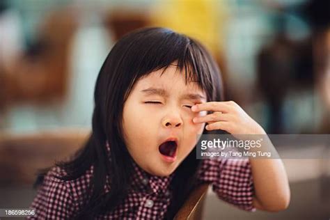 Asian Rubbing Eyes Photos And Premium High Res Pictures Getty Images