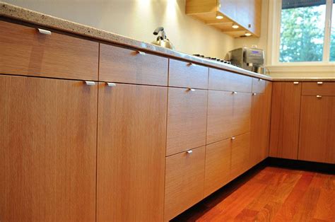 Rift sawn white oak pairs with painted cabinetry for a chic look in this large two island kitchen. Rift Swan White Oak Kitchen Seattle | White modern kitchen ...