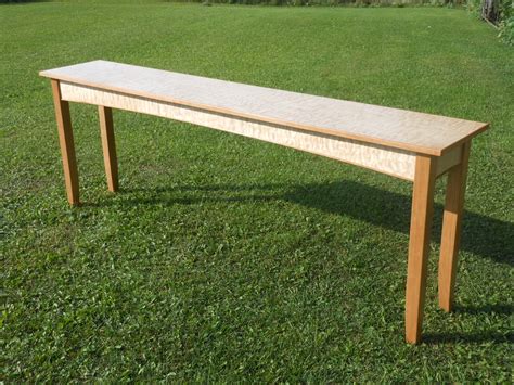 The smooth, blonde grain of a maple wood table lends itself perfectly to a contemporary and chic look. Long Quilted Maple Console Table