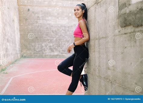 Fit Woman Leaning Against Wall With Right Foot Up Stock Image Image Of Active Health 162729973