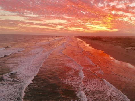 An Amazing Red Sunset At The Beach Djispark