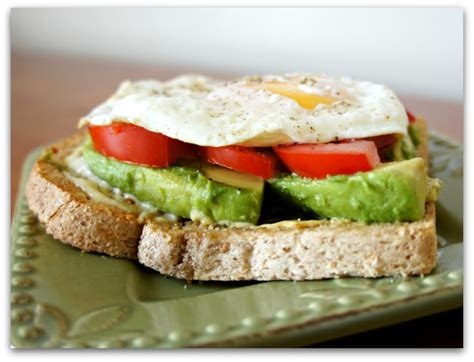 Fried Egg Sandwich With Tomato And Avocado On Whole Wheat
