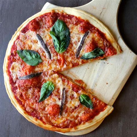 The outer shell is solid mozzarella, while the inside contains stracciatella and cream. Pizza Napoletana - Authentic Italian Recipe | 196 flavors