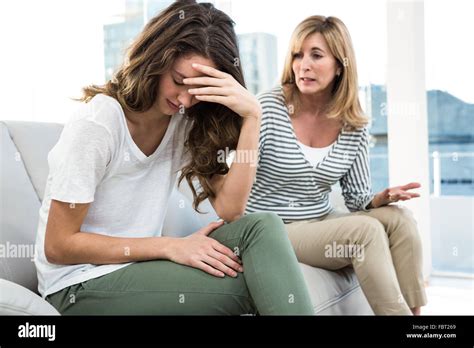 Sad Daughter Against Mother Stock Photo Alamy