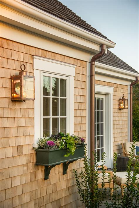 This townhouse is spectacular in white, lipped with window boxes that exalt this splendid exterior to the realms of true magnificence. Green Window Box | Cottage exterior, Window trim exterior ...