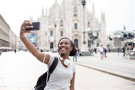 Young Black Woman Taking Selfie With Smart Phone Hand Hold With Milan