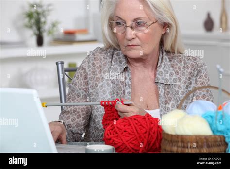 Elderly Woman Knitting Stock Photo Alamy