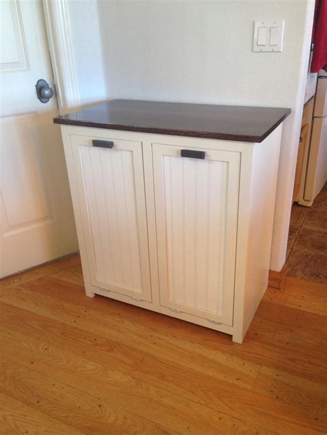 Integrating the trash bin into the kitchen island can often be even better than keeping it under the sink. A tilt-out garbage and recycling cabinet. in 2020 | Trash ...