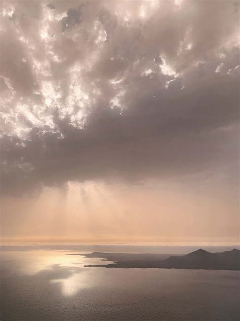 Outdoors Body Of Water Under Cloudy Sky During Daytime Weather Image