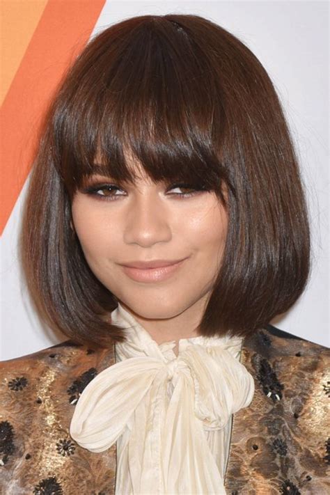 The back and sides of this formal short do are tapered into the head blending into the top which is her dark brown eyes pop with this hair hue as well. Zendaya's Hairstyles & Hair Colors | Steal Her Style