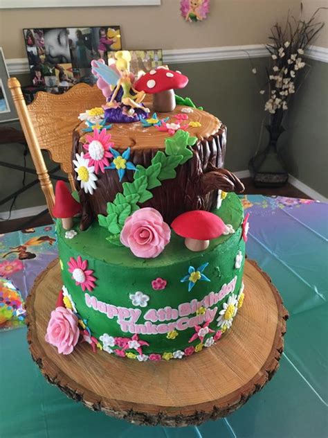Use the cut pieces of cake to form the flower. Tinkerbell Cake - CakeCentral.com